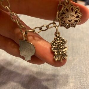James avery sun, flowers and bracelet are James Avery. Boy is not James Avery
